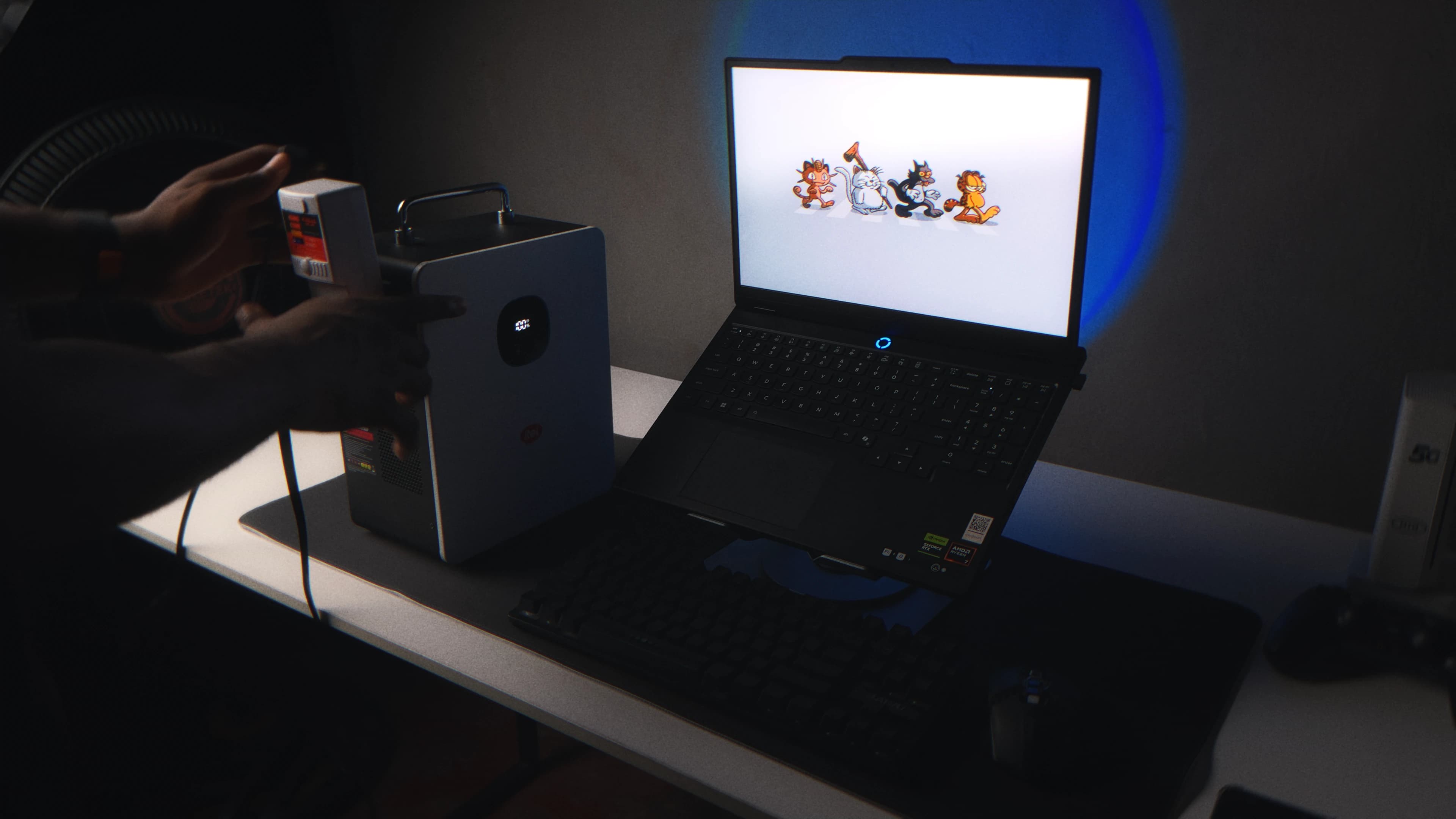 Laptop and fan connected to the itel PowerTank at 100 percent battery