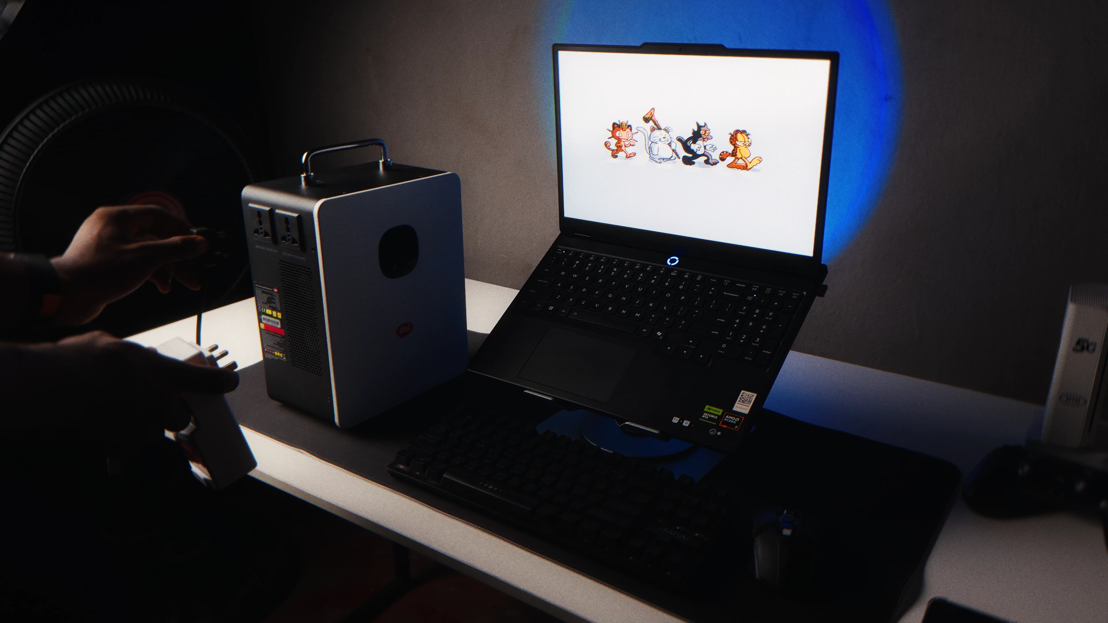 itel PowerTank beside a laptop and fan in a normal work setup